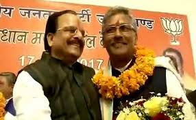 त्रिवेंद्र रावत ने उत्तराखंड के सीएम के रूप में शपथ ली PM मंच पर मौजूद